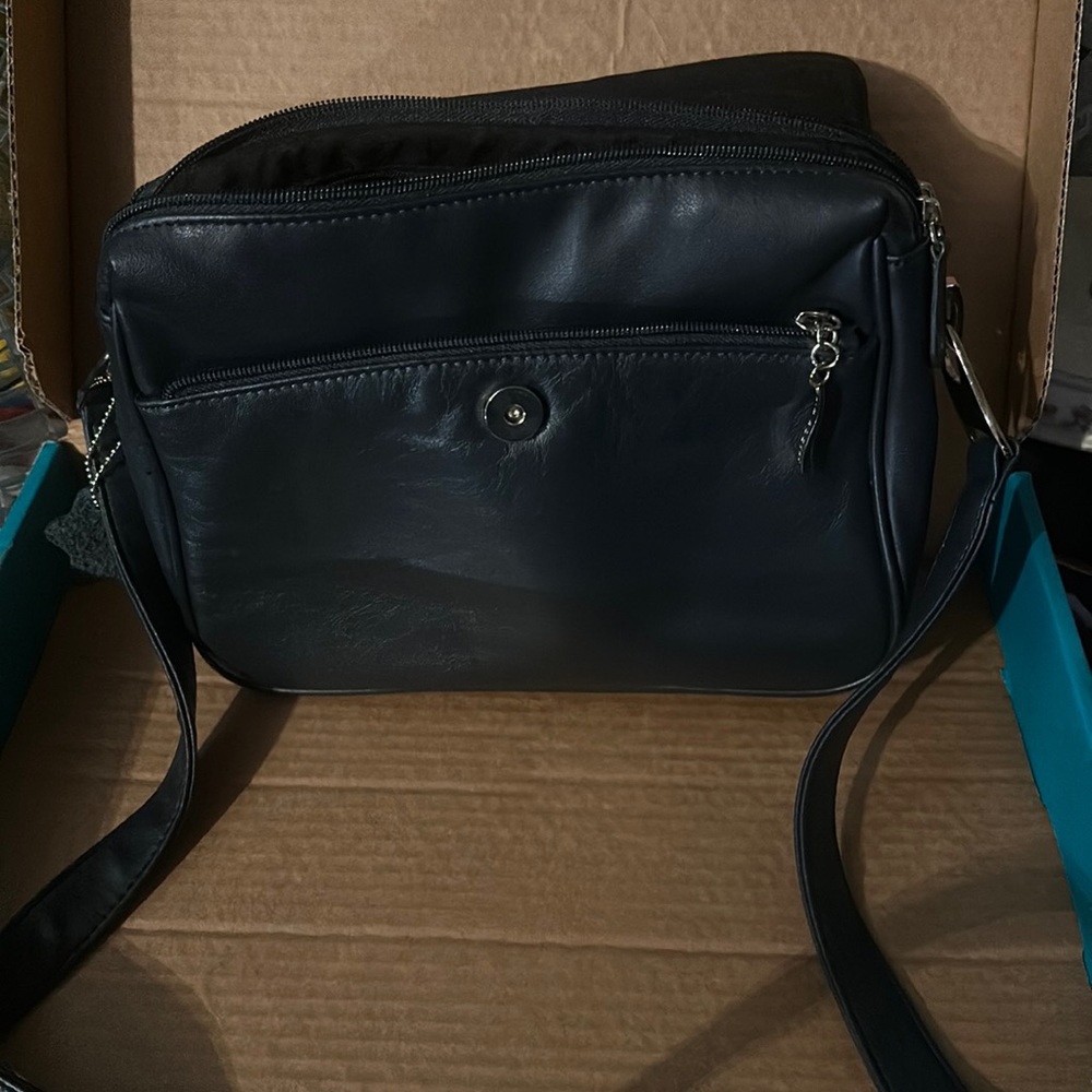 Kim rogers genuine leather hand bag black in color